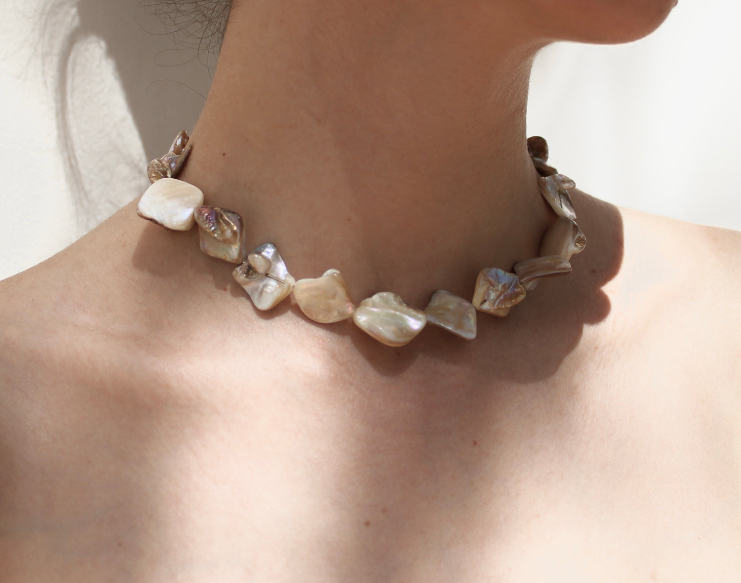Exquisite mother of pearl shell necklace, showcasing unparalleled uniqueness and natural beauty in its design.