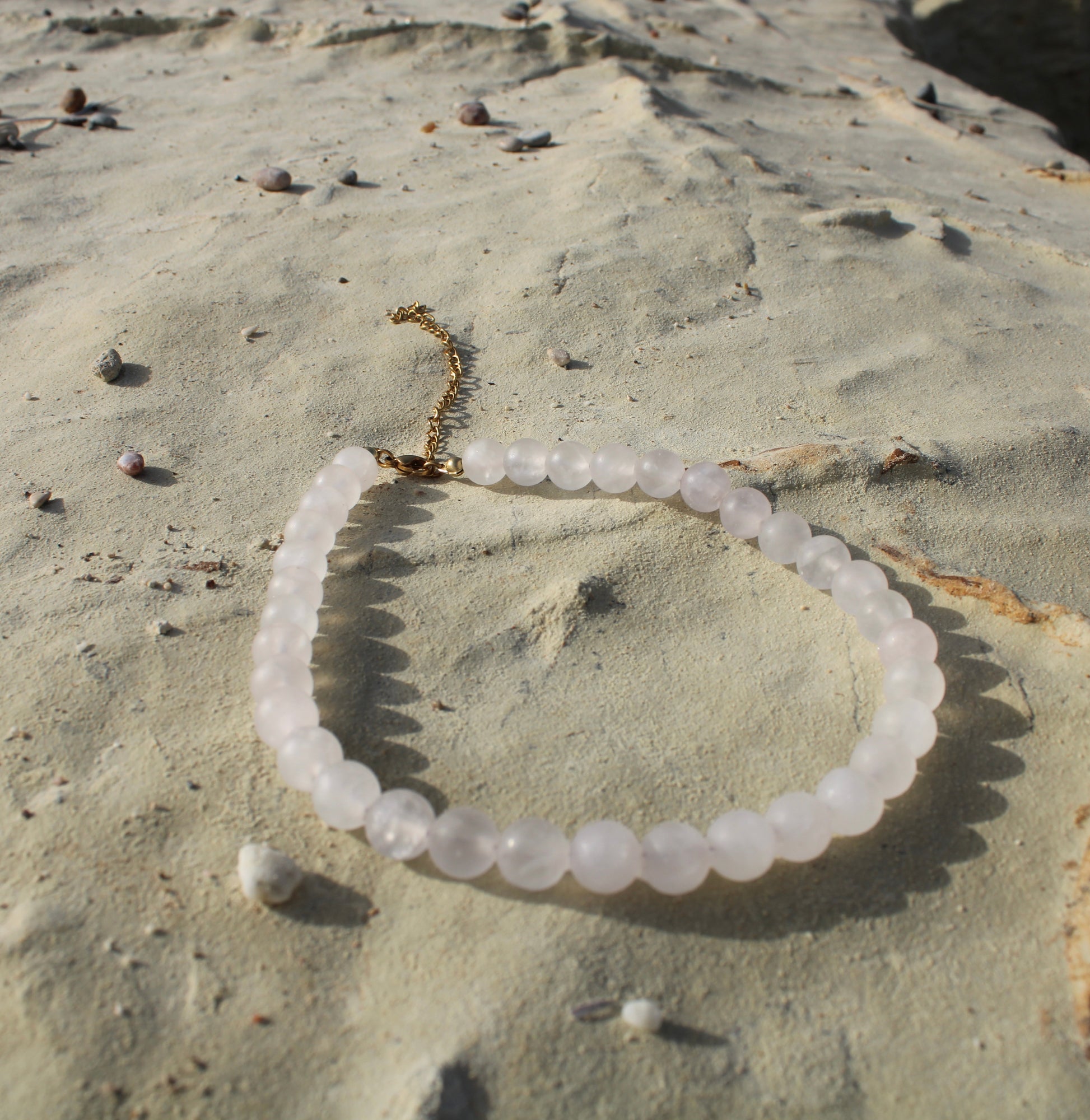 Pale pink quartz necklace, delicately crafted for a subtle yet radiant touch of femininity.