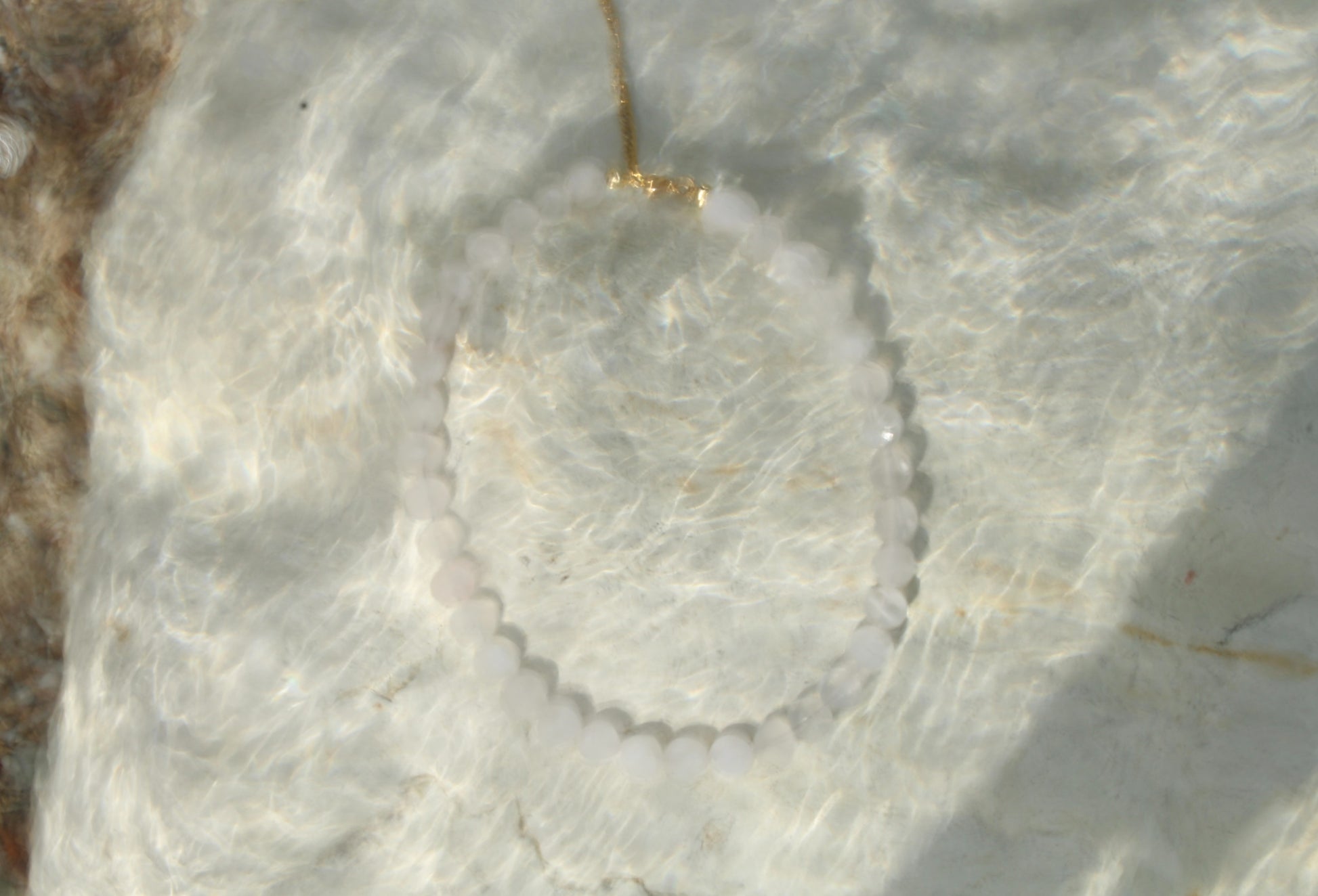 Pale pink quartz necklace, delicately crafted for a subtle yet radiant touch of femininity.