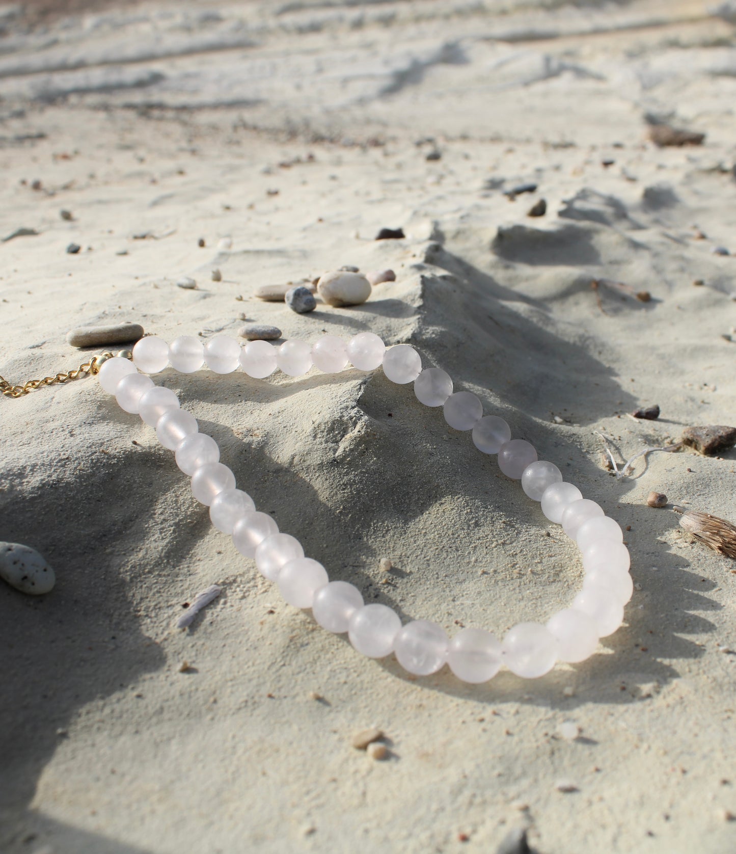 Pale pink quartz necklace, delicately crafted for a subtle yet radiant touch of femininity.