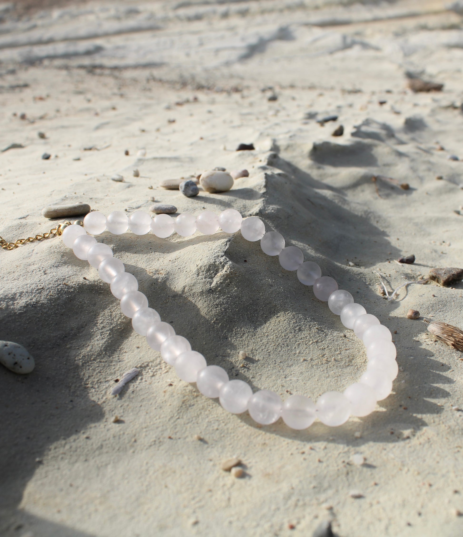 Pale pink quartz necklace, delicately crafted for a subtle yet radiant touch of femininity.